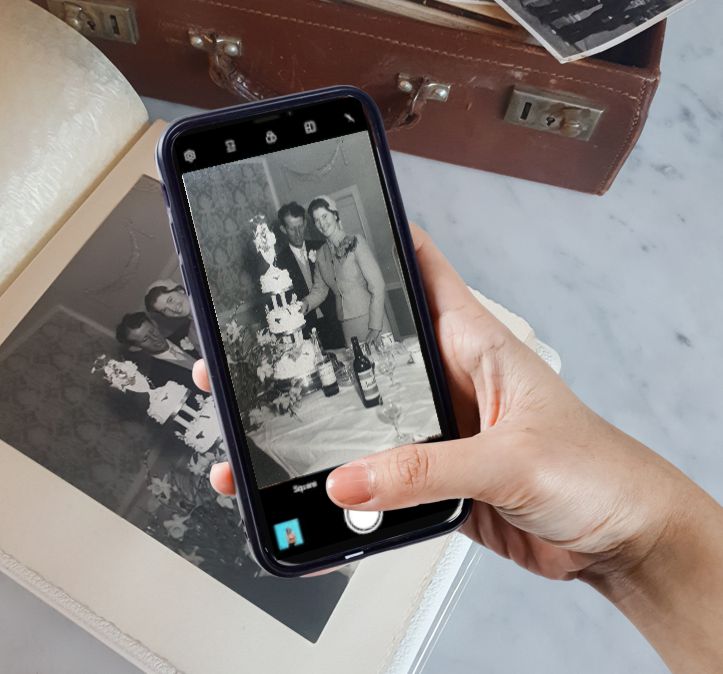 Take a snap of the old photo using your mobile phone.